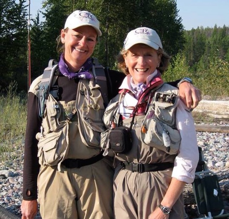 Our mom (left), posing with her river helper at the Casting For Recovery Retreat in Glacier National Park